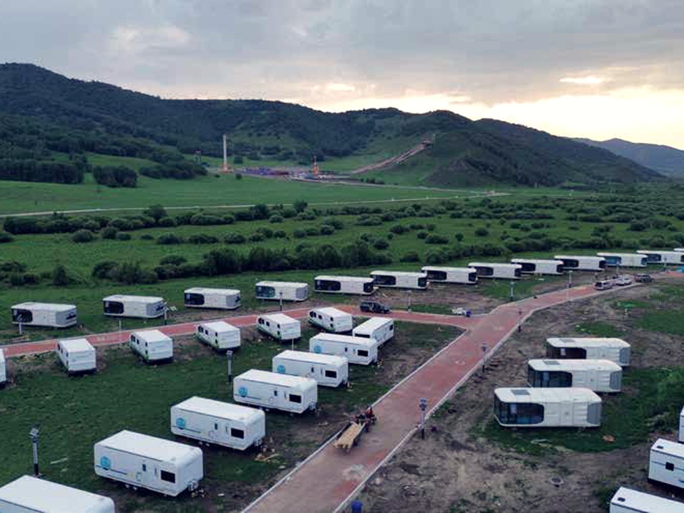 Units laid out across a valley camp