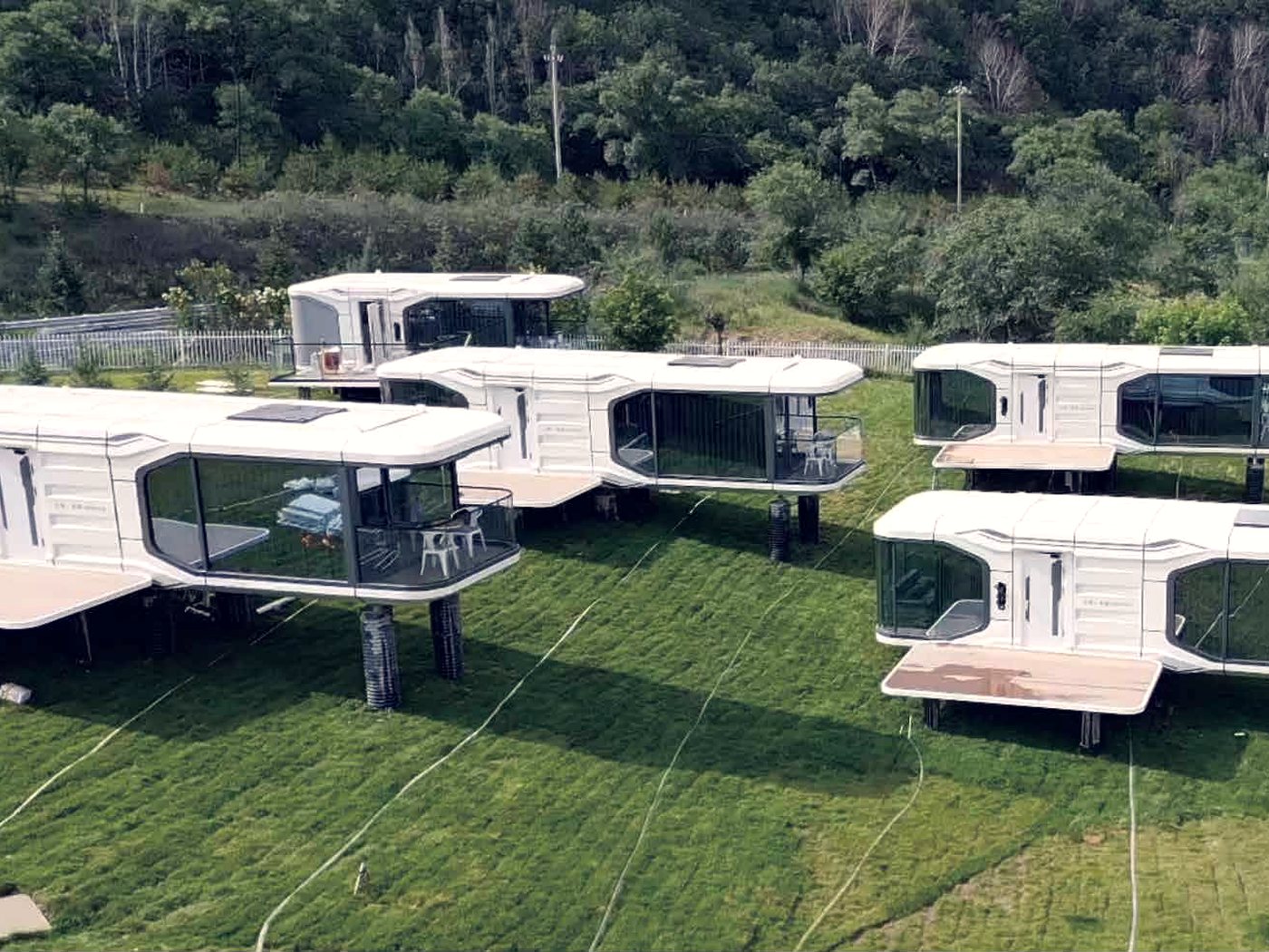 Units on a green slope, each with its own deck