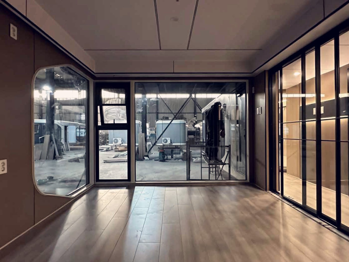 Interior of a studio unit, looking out to the garden