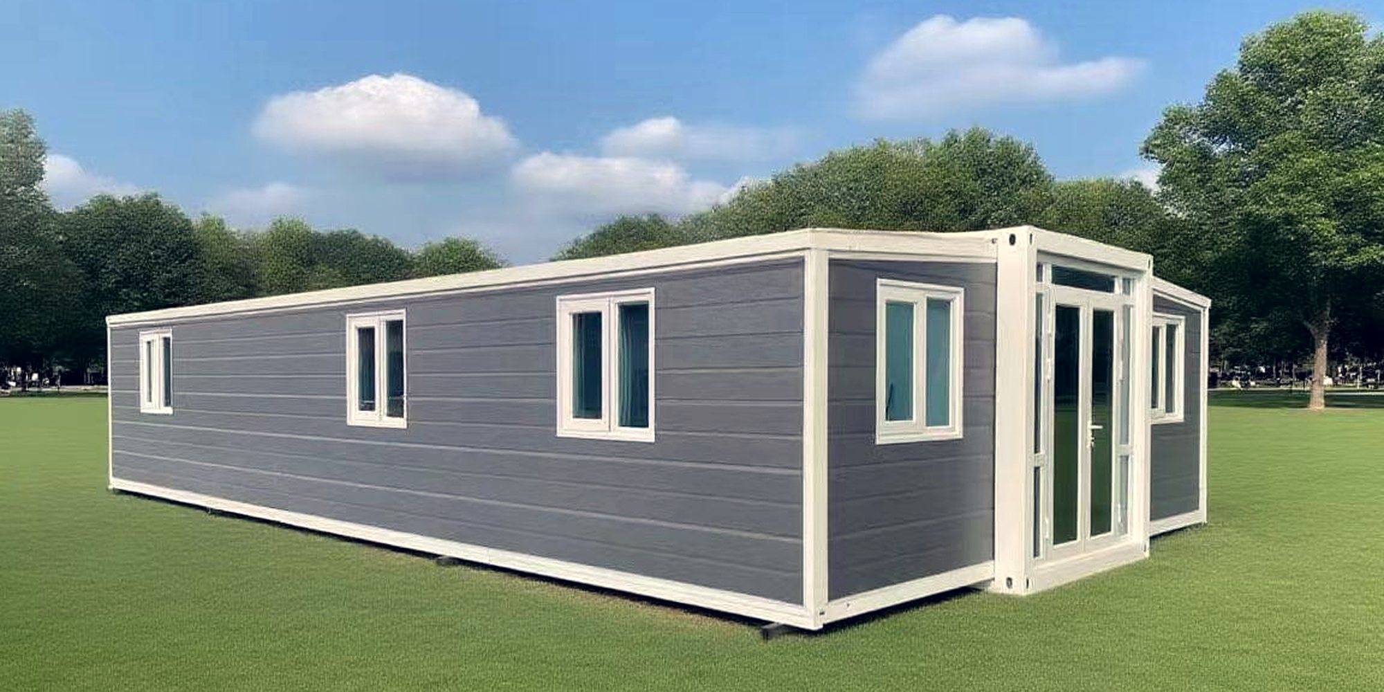 A prefabricated garden studio installed on a mown lawn
