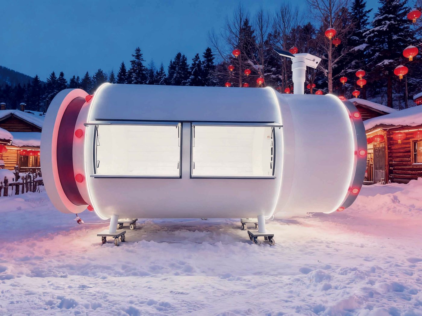 Capsule pod at a snow resort, lit at blue hour