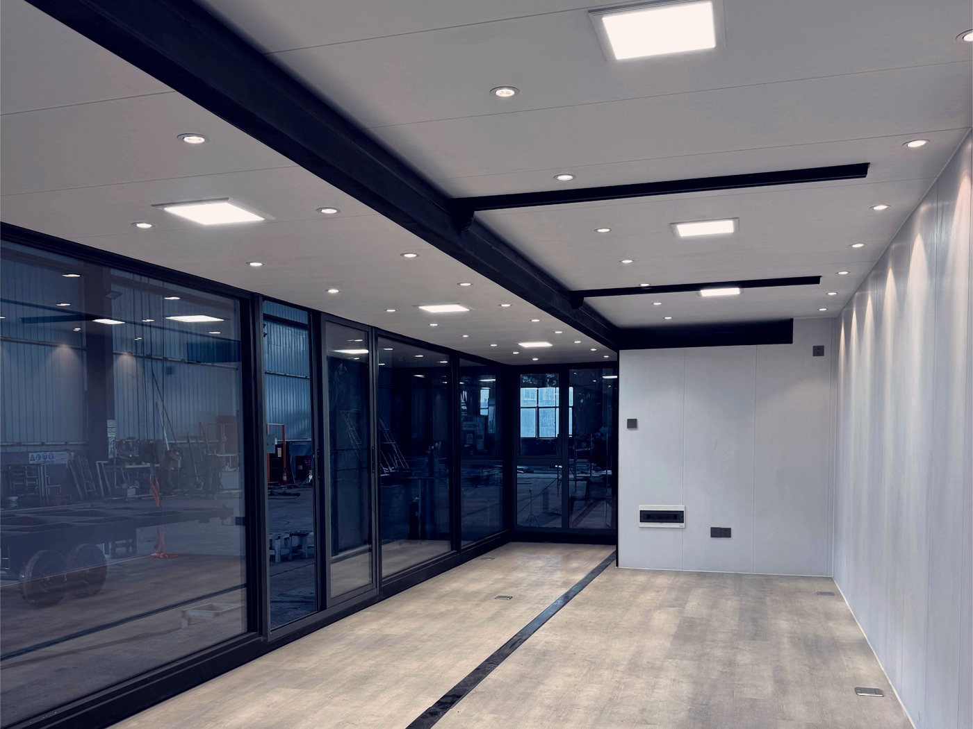 Modular interior: full-height glazing and steel framing